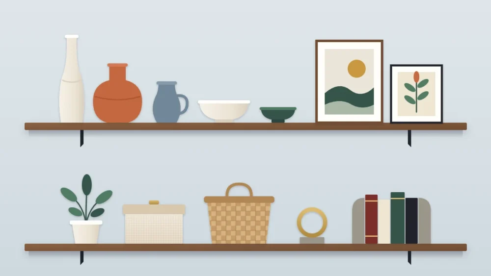 Two long shelves of decor grouped by family: ceramic vases, bowls, framed abstract art, a plant, a lidded box, a basket and stone bookends