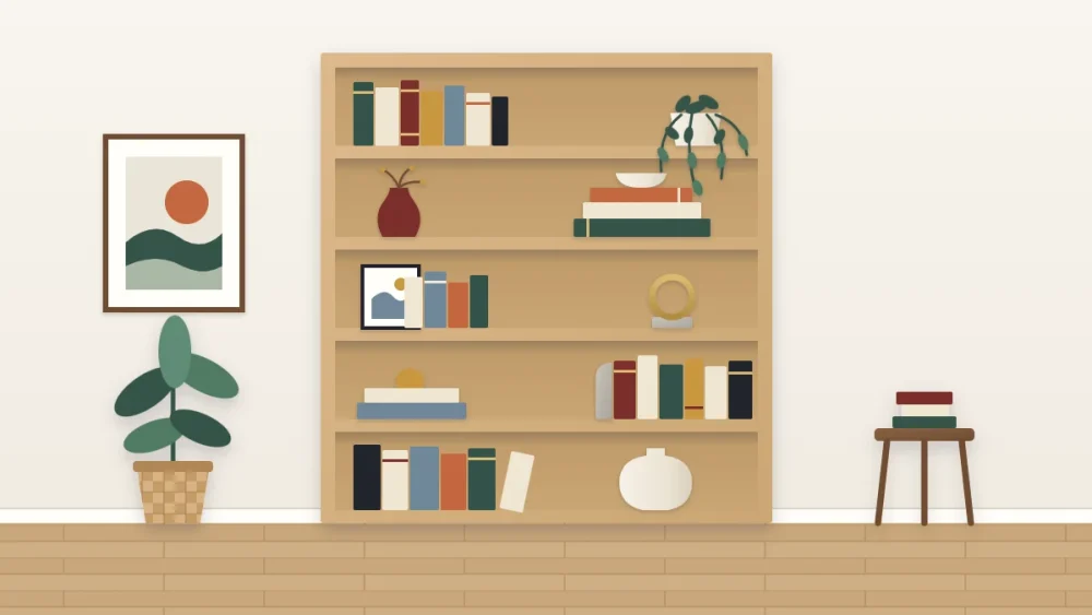 Tall oak bookcase with five calmly styled shelves of books, flat stacks, a vase with branches, a leaning print and a trailing plant