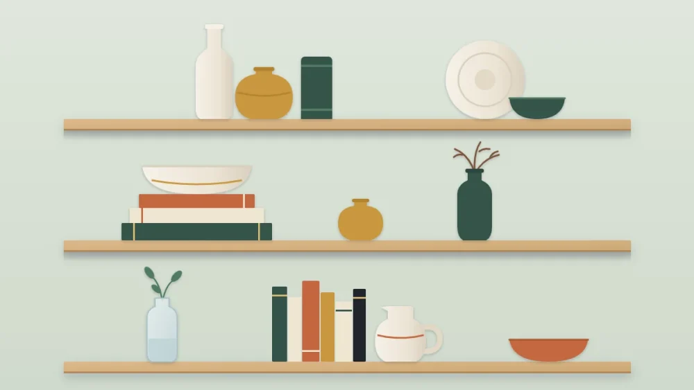 Three shelves of ceramic vessels: a group of three vases in cream, ochre and green, a bowl on stacked books, a tall vase with branches